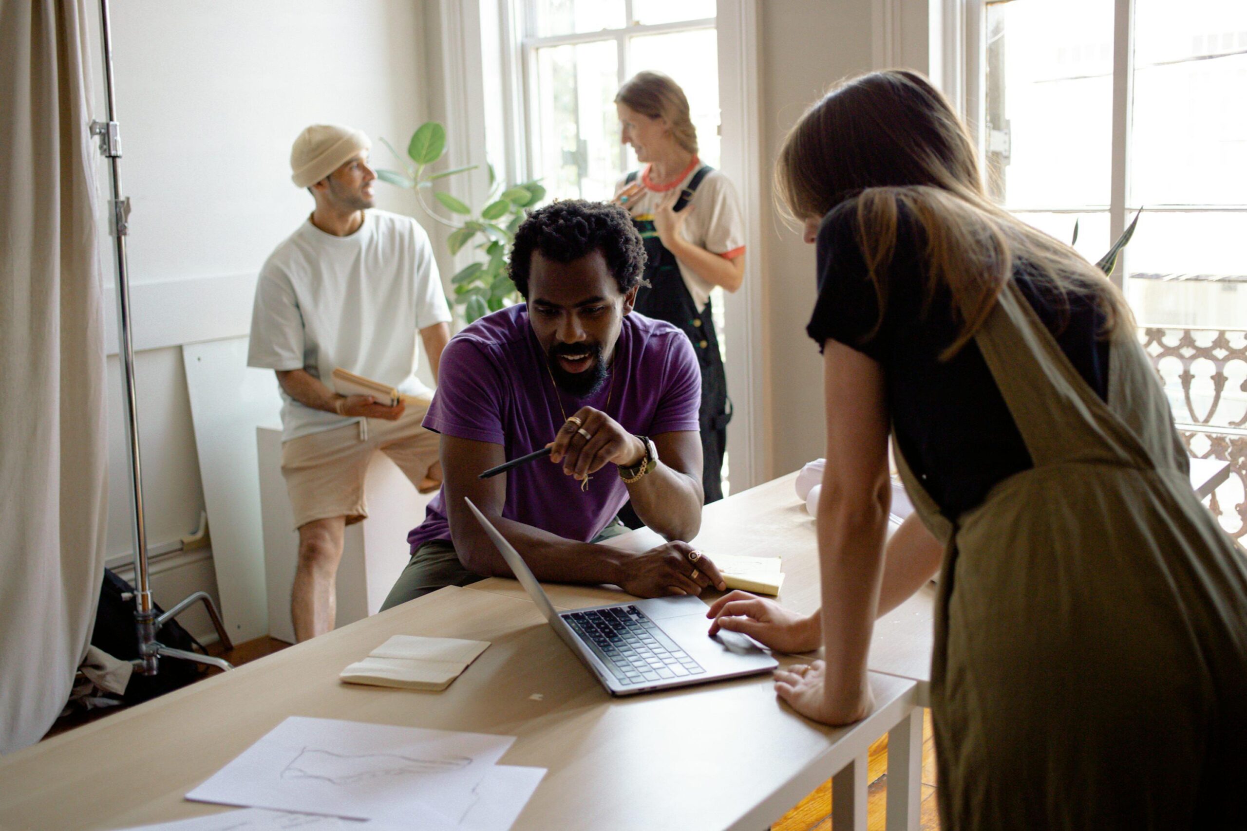 people in an office discussing a project
